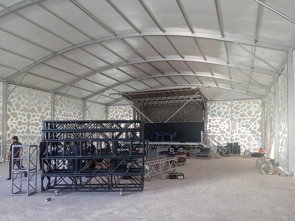 Interior of 50x80 ft high-ceiling structure tent with open-span design for large events.