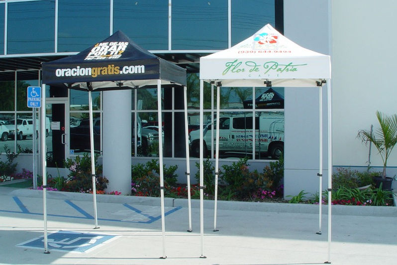 Two 5x5 branded canopies for OracionGratis and Flor de Rafa used for street outreach