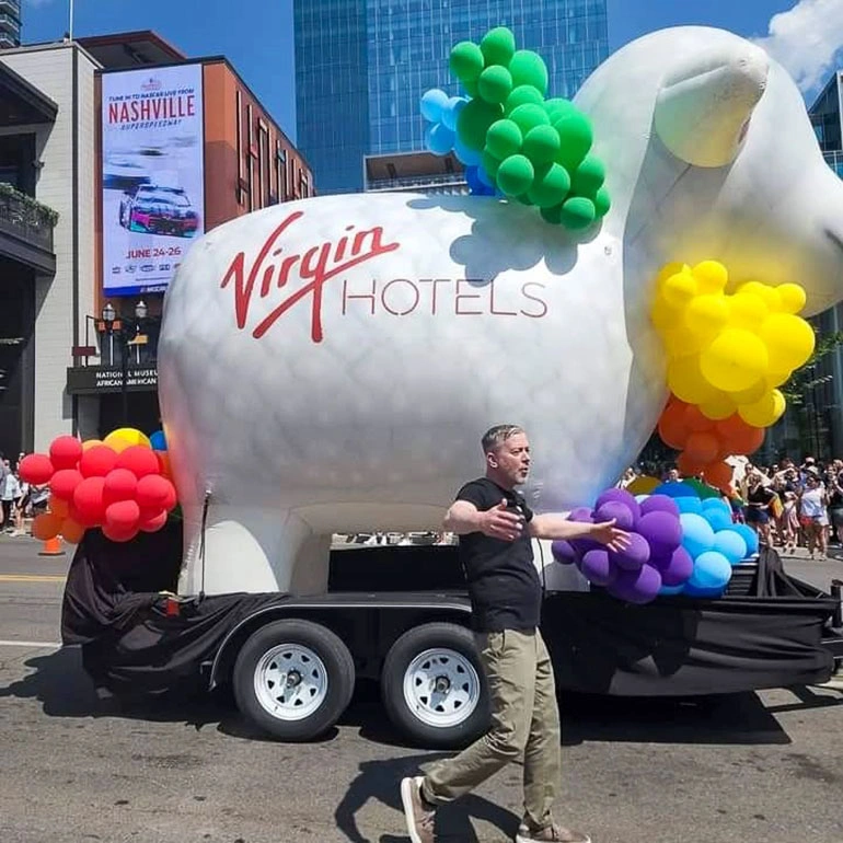 Virgin Hotels Snoozy giant inflatable sheep on a trailer with balloon accents during a city activation