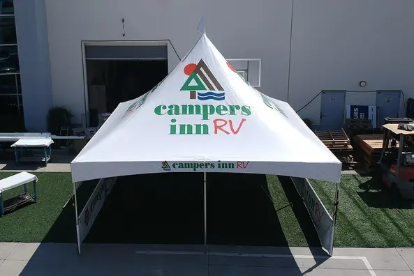 Campers Inn RV custom high peak tent with branded valance and full wall print