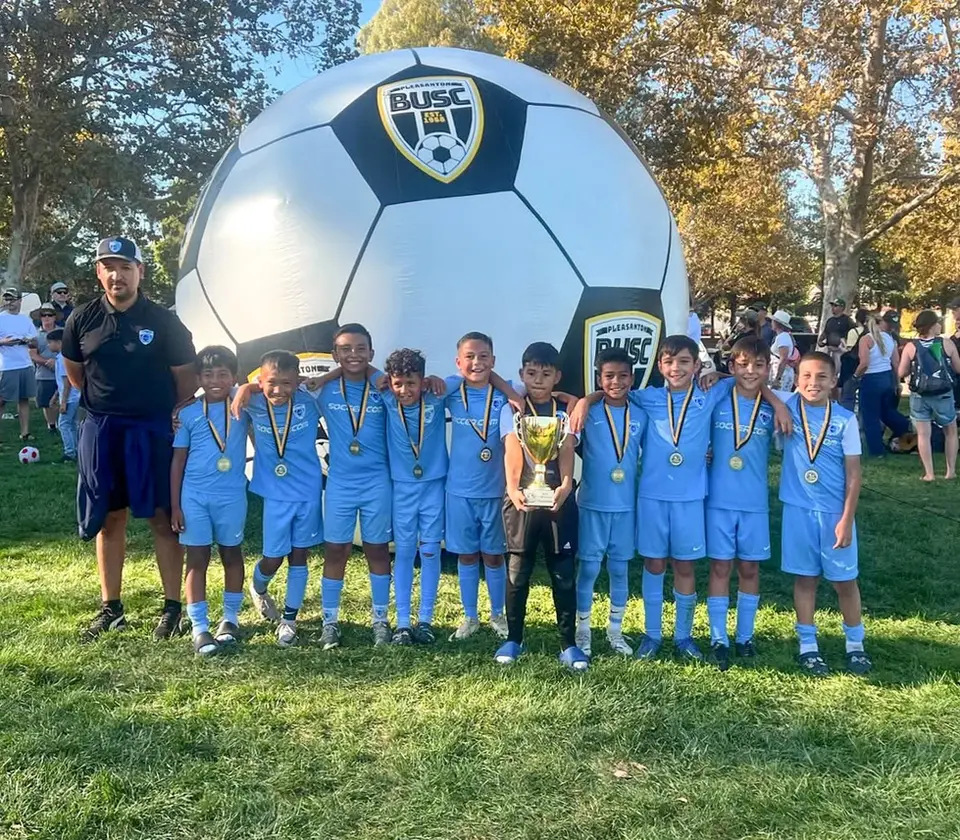 Custom giant inflatable soccer ball for BUSC at a youth soccer event