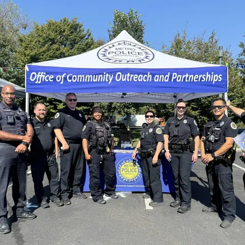 Custom police outreach tent with department branding set up for local community engagement