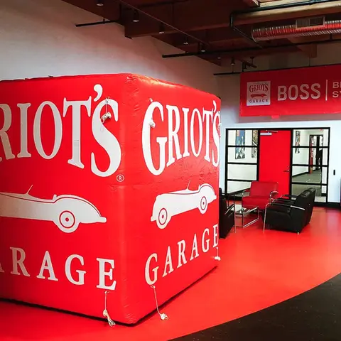 Custom inflatable sign featuring the Griot's Garage branding, displayed indoors to enhance brand visibility and create a bold promotional statement.