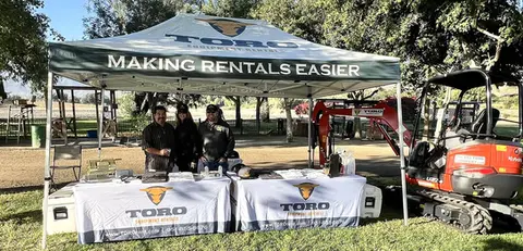 Custom 10x10 canopy for rental equipment company with branded tables