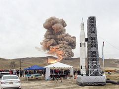 Giant inflatable rocket ship with launchpad at event