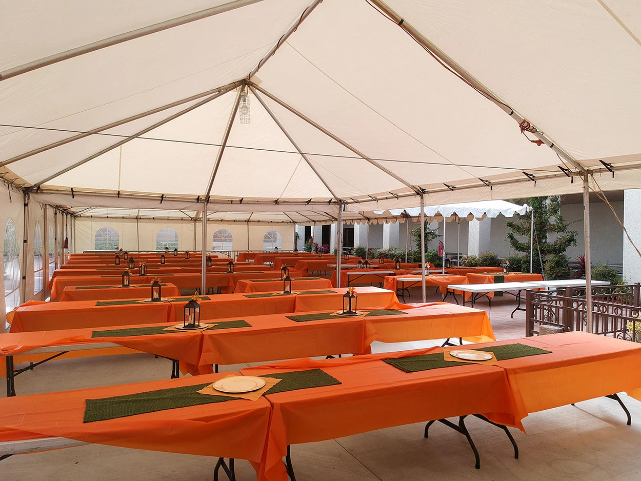 White pole frame tent for community gatherings