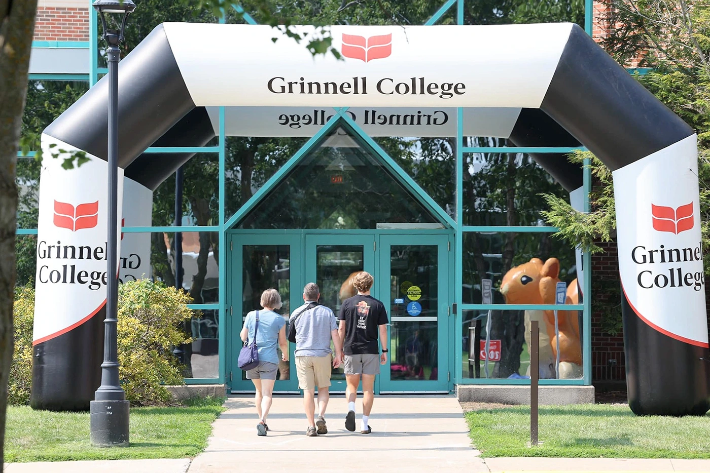 A branded inflatable arch used at the entrance of Grinnell College for student engagement, wayfinding, and event day visibility.