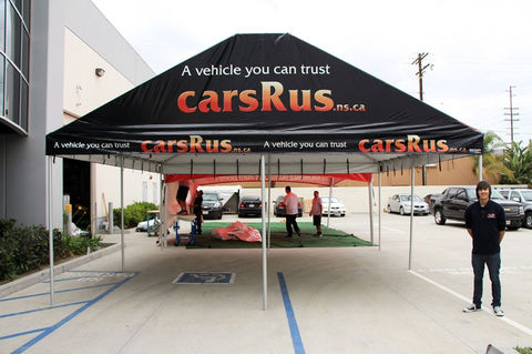 Black custom gable tent for auto dealership marketing event with CarsRus branding