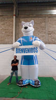 Custom inflatable mascot character with welcome message at a business entrance