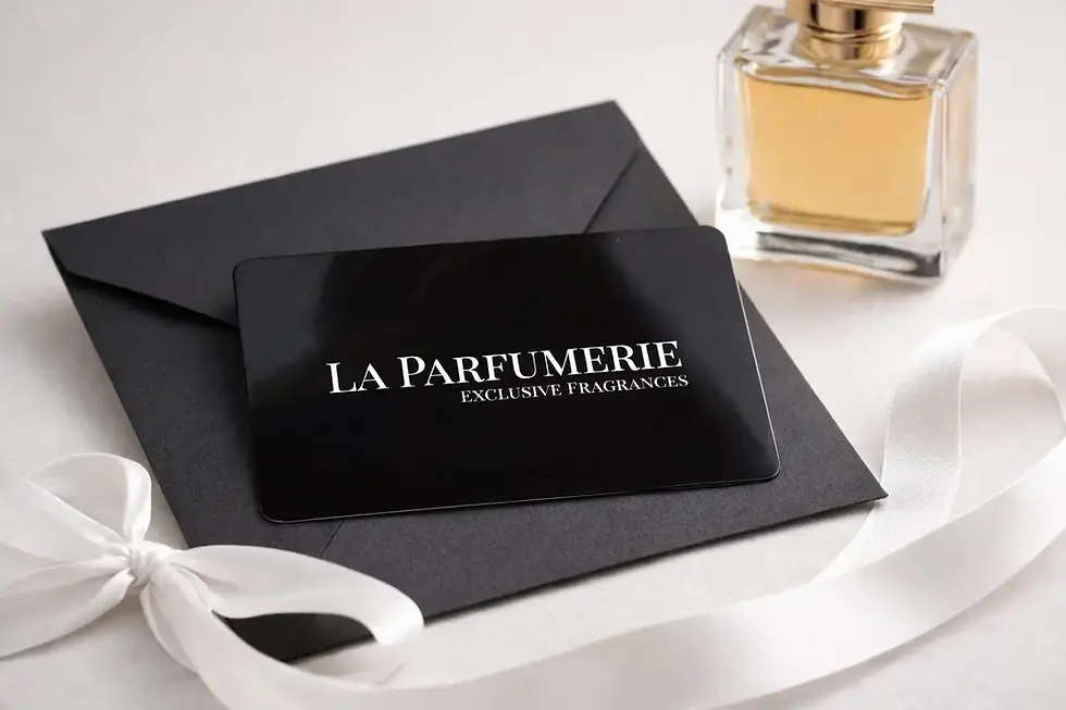 A La Parfumerie gift card with a white satin ribbon