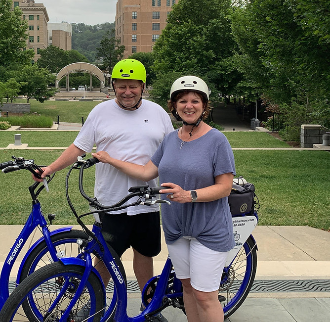 Owners of Circle City E-Bikes showcasing their personal e-bikes that they happily own.