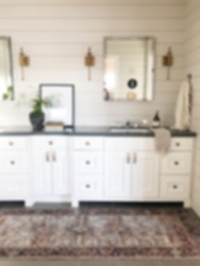 Lisa Clark Design Interior Design Steinbach shiplap oriental rug bathroom Winnipeg Manitoba white cabinets custom shower pebble floor brass sconce chrome faucet