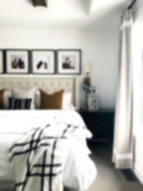 Lisa Clark Design Interior Design Steinbach Winnipeg Manitoba master bedroom king bed white linen brass sconces beams