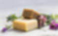 two bar of organic soaps and wild flowers made at an yoga retreat center in Portugal