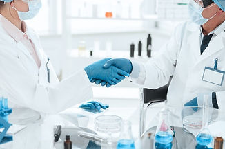 close-up-microbiology-scientists-shaking