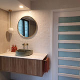 Master Ensuire of a house in Brisbane after Milu Interiors re-designed the space, including new tiles, lighting, cabinetry, and tapware