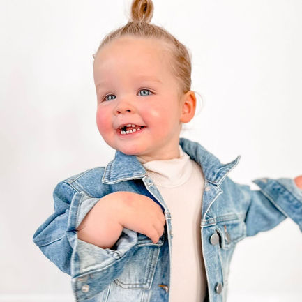 Little girl wearing personalised denim jacket by Scripted Cubs Australia