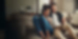 couple couch AdobeStock_492456396 EXPANDED_DARKENED.jpg