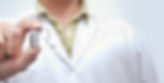 Man holding a hearing aid
