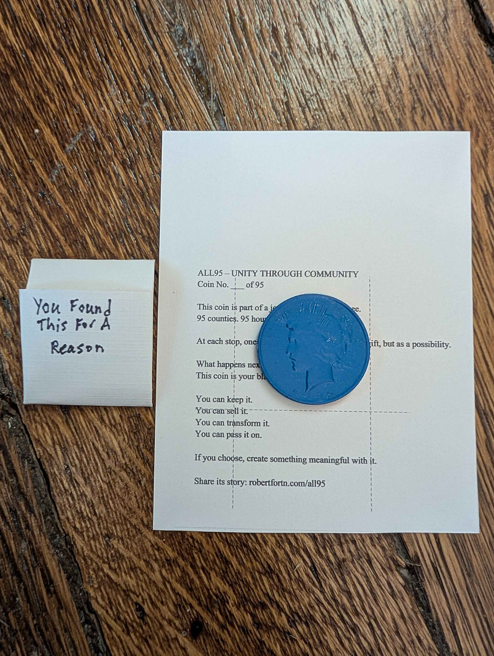 Picture shows the handmade envelope that will hold the painted peace coins placed around Tennessee for the ALL95 Challenge. The envelope says "You found this for a reason."