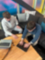 IZ Optimization founders Calvin Zimmerman and Ben Isaacson reviewing client results and feedback
