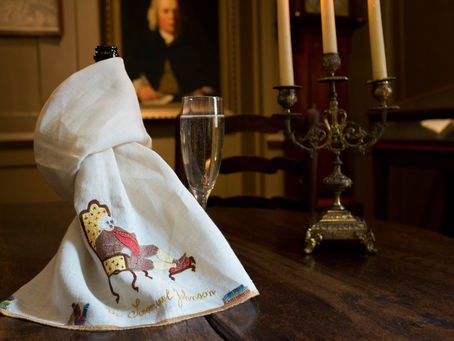 The Parlour at Dr Johnson's House with candelabra and glass of sparkling wine