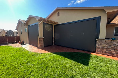 motorized exterior all-weather screens providing privacy and shade / sun protection