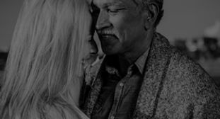 happy-senior-couple-dancing-by-the-sea-2
