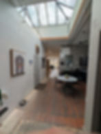 Studio Commons interior with skylight and dog portrait.