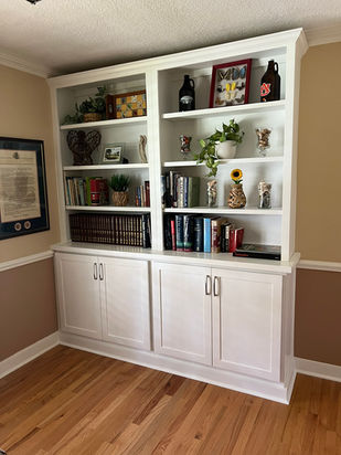 Small custom display cabinet with open shelves and storage below