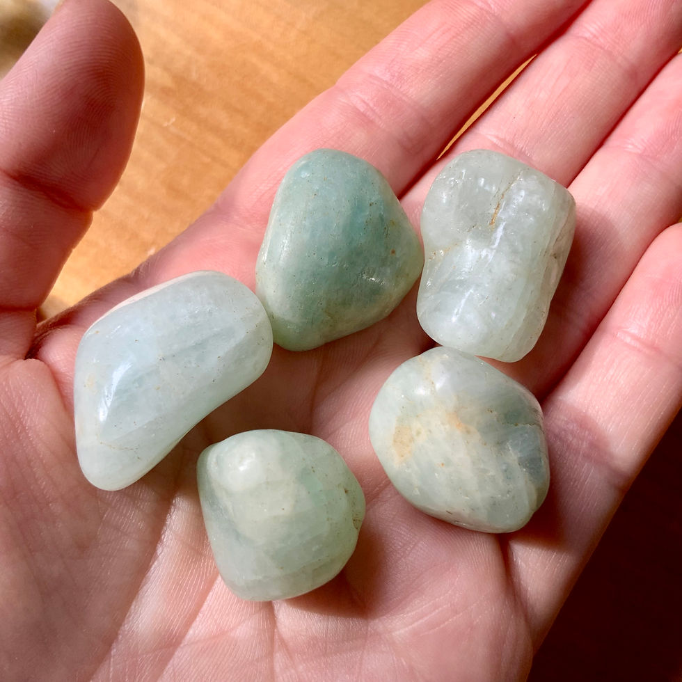 Thumbnail: Aquamarine tumbled crystals at metaphysical crystal shop canada