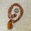 Thumbnail: Golden healer Quartz copper wire wrapped necklace by Sah at Blue Apples metaphysical crystal shop