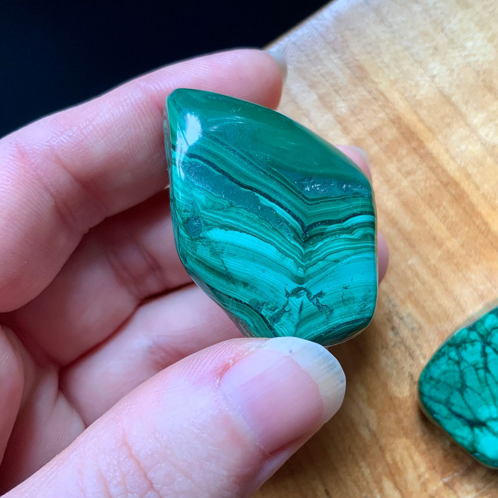 tumbled malachite stones at metaphysical crystal shop