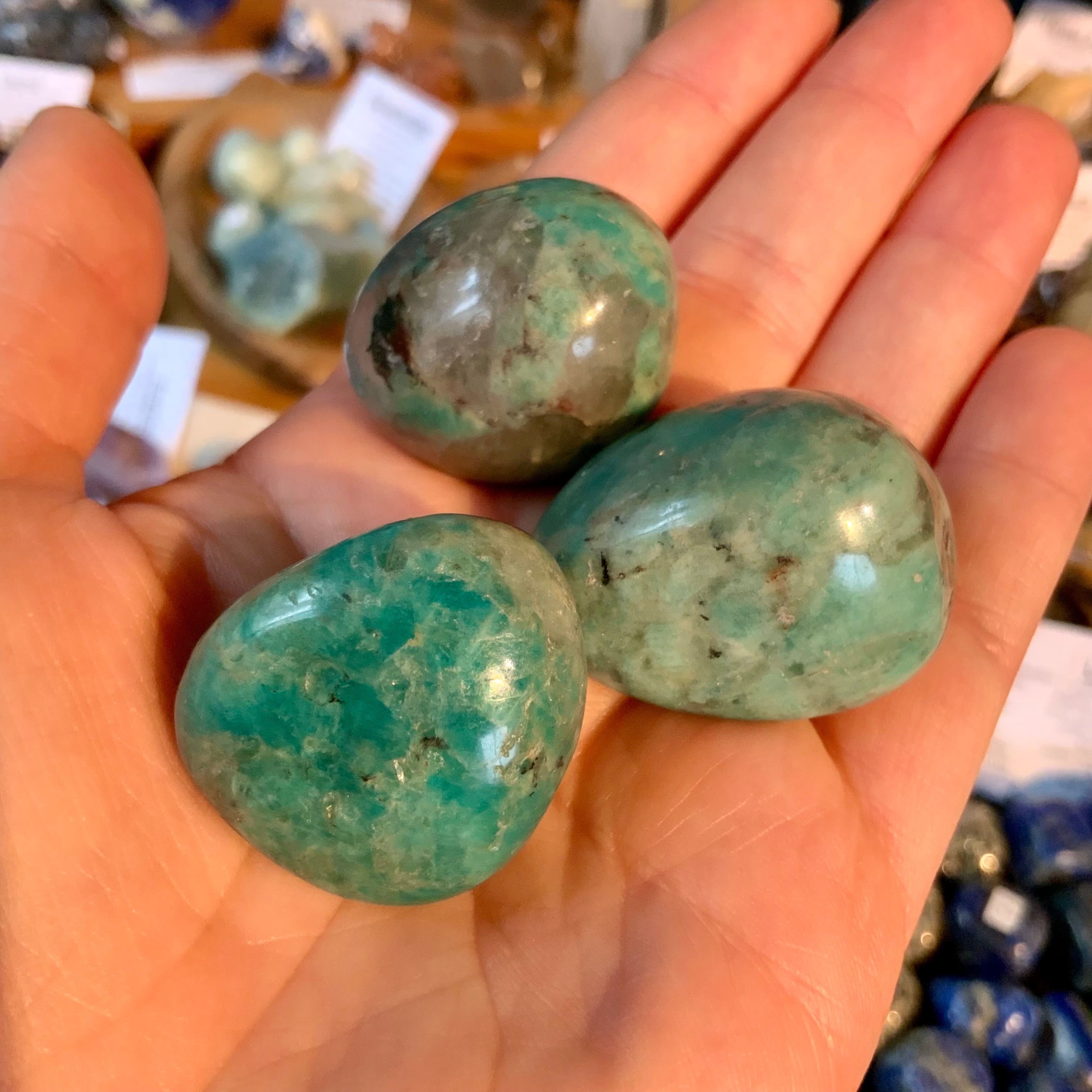Tumbled Amazonite with smoky Quartz at metaphysical crystal shop in Canada