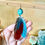 Thumbnail: Sah’Rah parrot feather earring