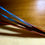 Thumbnail: Macaw tail parrot feather fan at metaphysical crystal shop