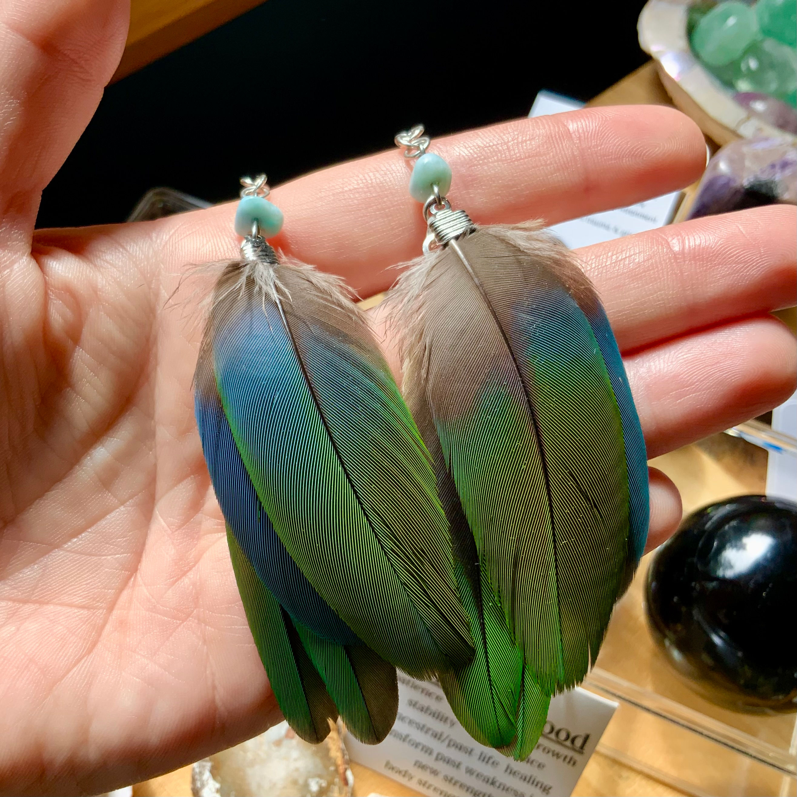 Green parrot feather earrings with Larimar by Sah at metaphysical crystal shop Canada