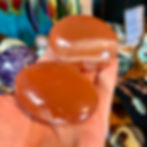 Honey calcite palm stone at metaphysical crystal shop Canada
