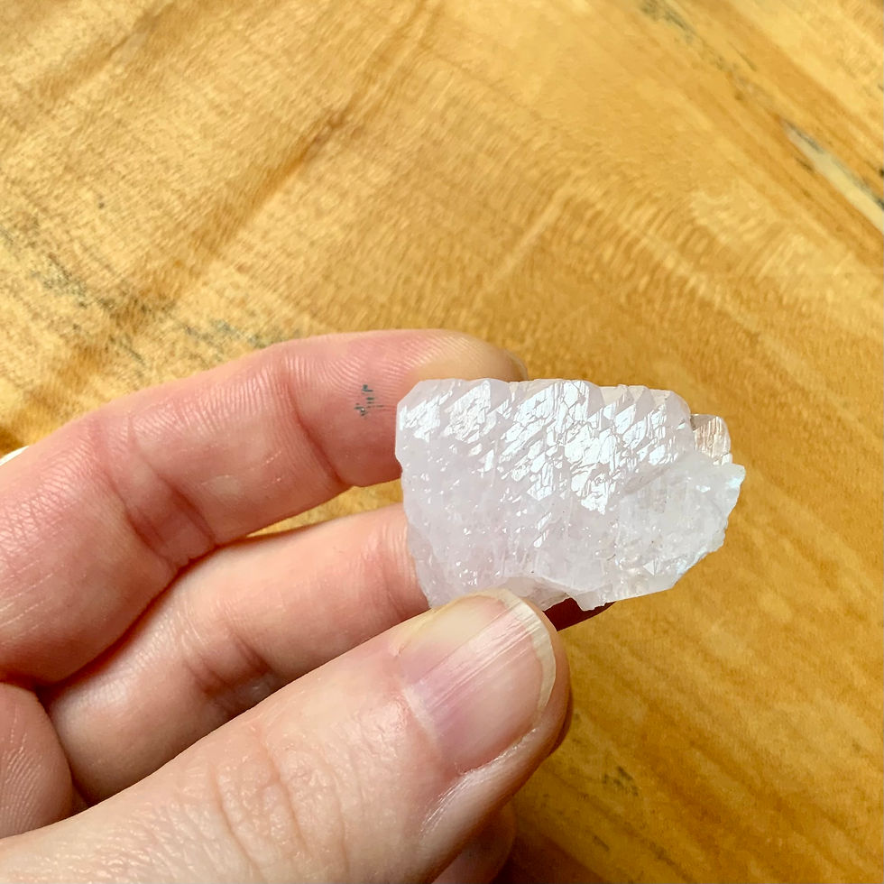 Raw Pink Mangano calcite at metaphysical crystal shop