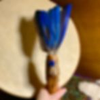 Macaw parrot feather fan with Lapis at metaphysical crystal shop