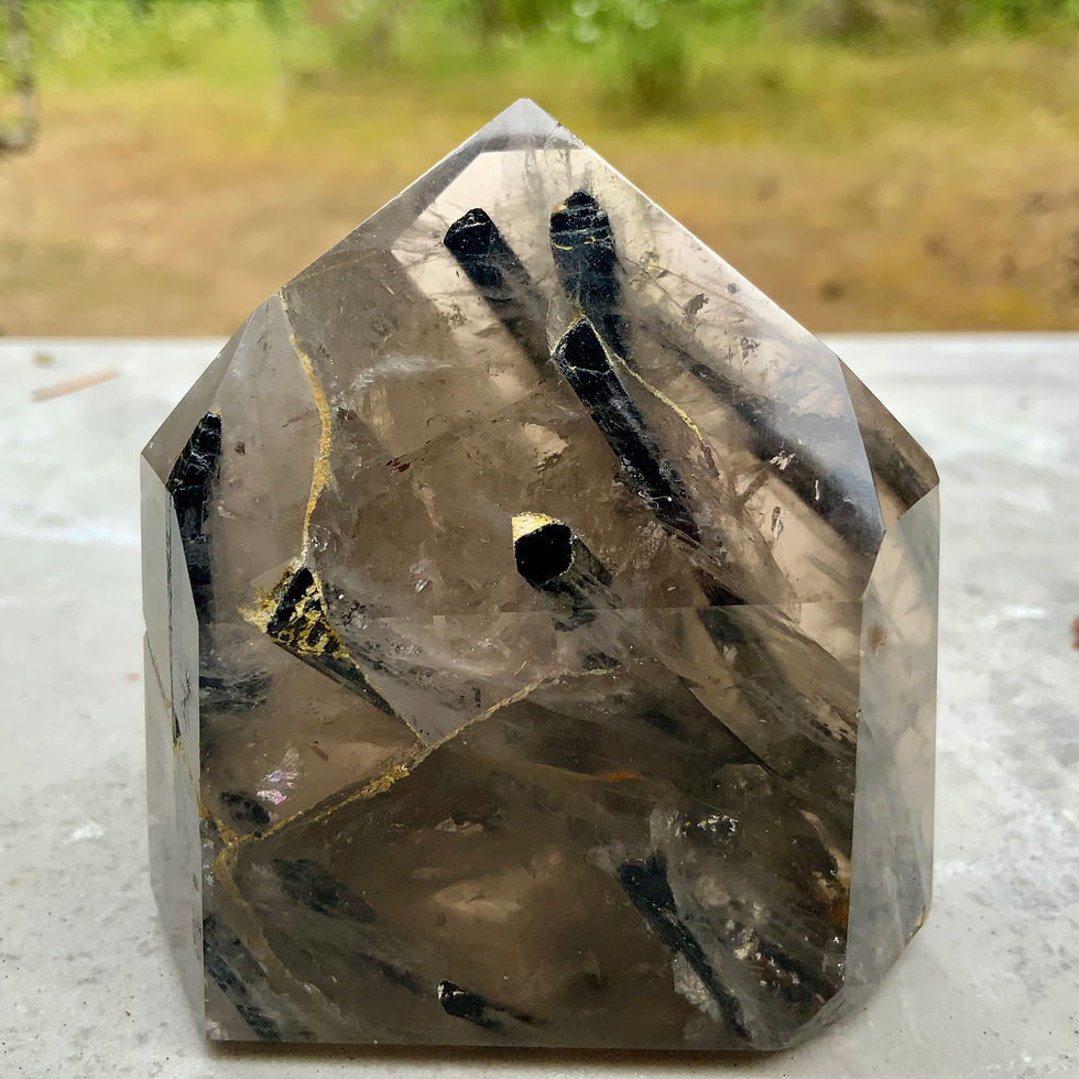 Tourmalinated smoky Quartz tower at metaphysical crystal shop in Canada