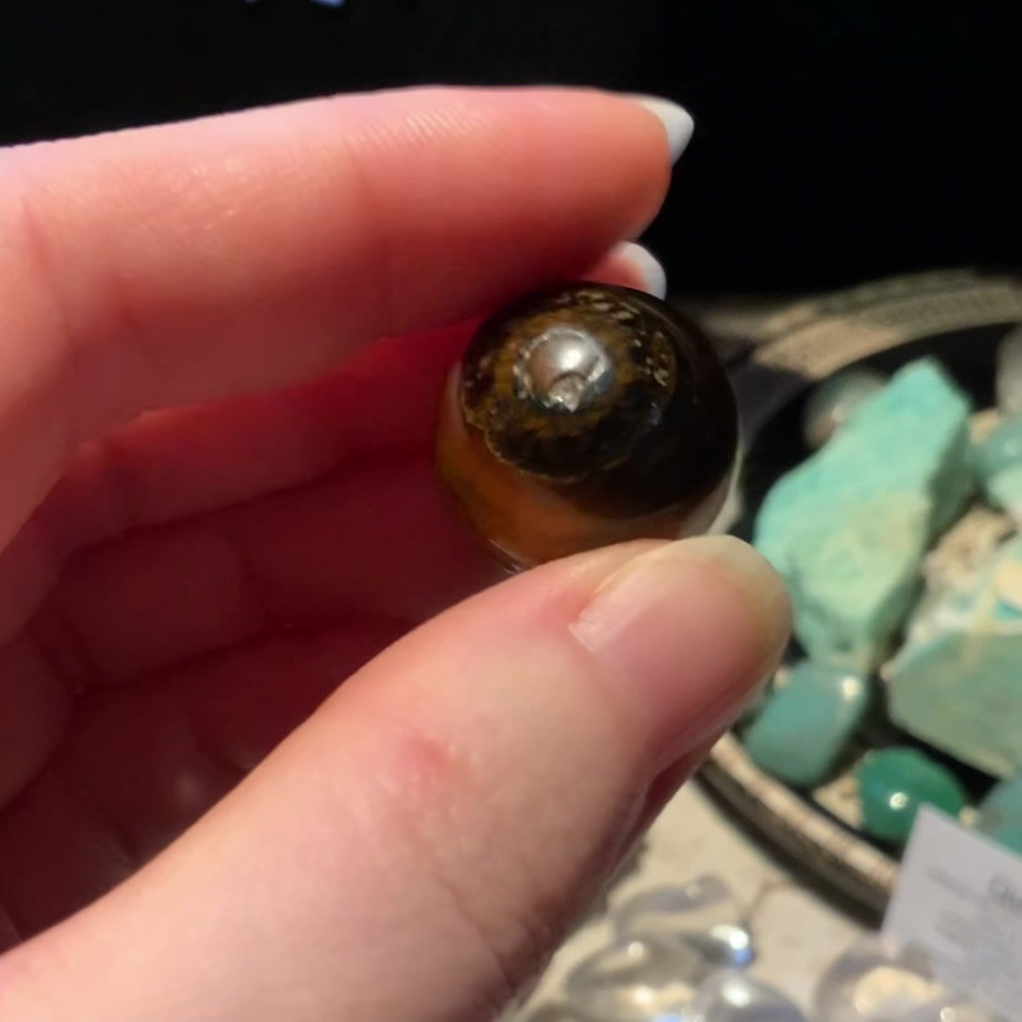 Small tigers eye sphere crystal ball at metaphysical crystal shop Canada