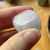 Tumbled Mangano calcite at metaphysical crystal shop Canada