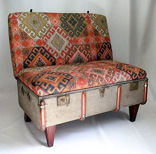 an old trunk made into a sofa 
