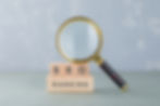 Conceptual of seo analysis and business. With wooden blocks with words on it, magnifying glass side view