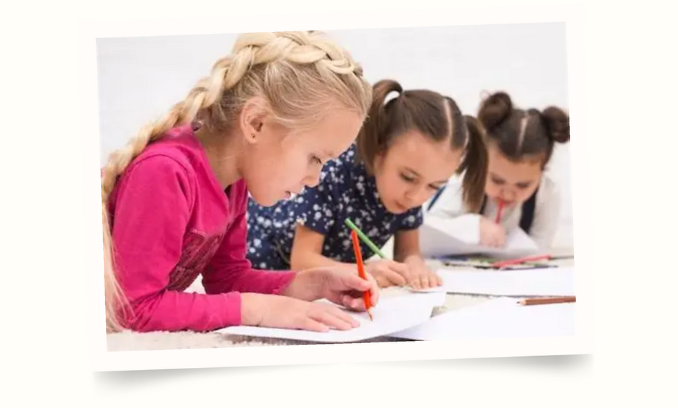 little girls drawing next to each other.