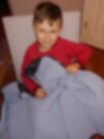 child receiving weighted blanket