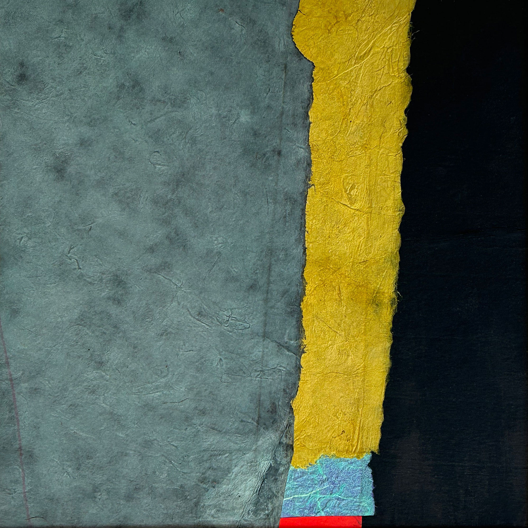 Mustard, bright blue and vermilion papers slice through a grey and black composition.