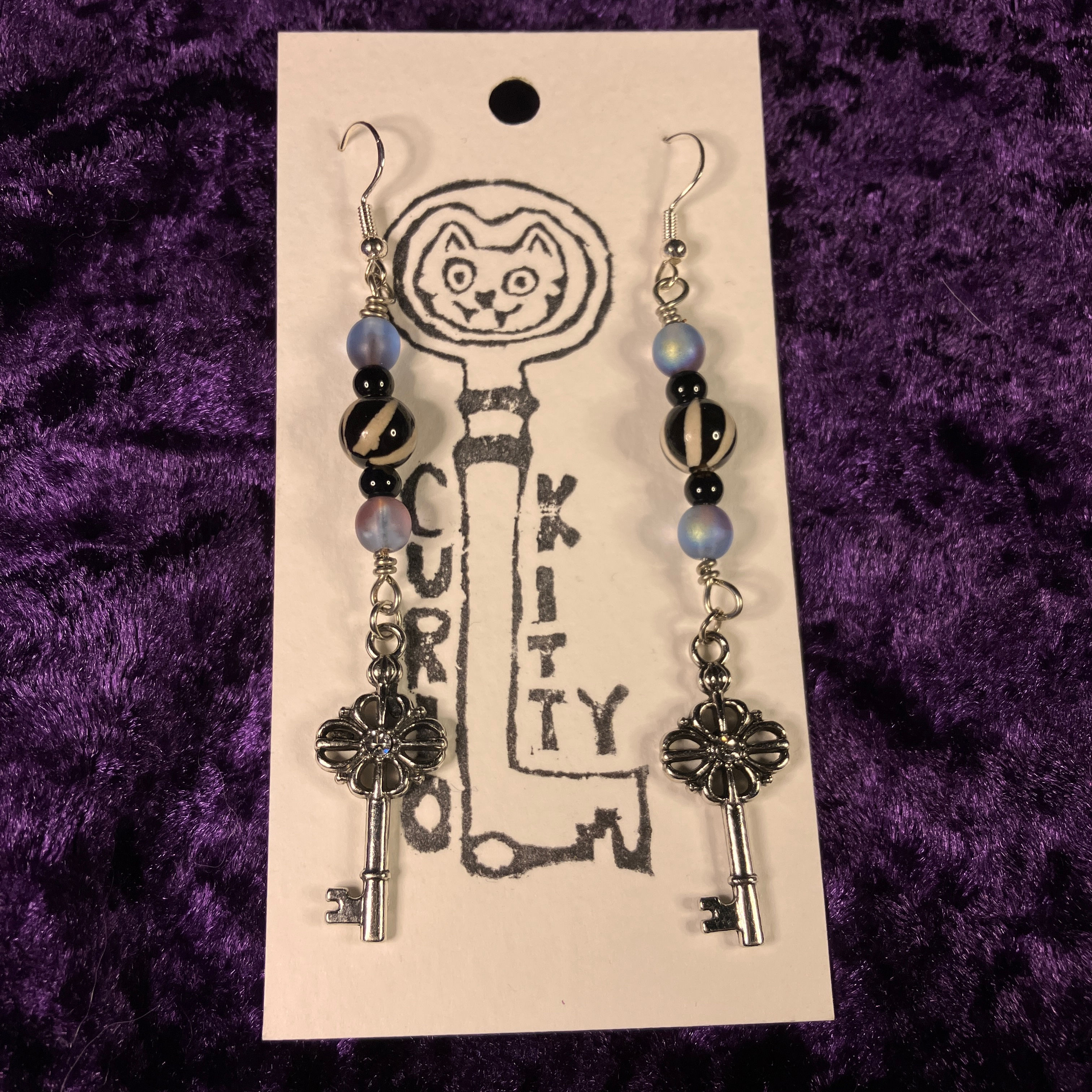 silver key dangles 🗝️