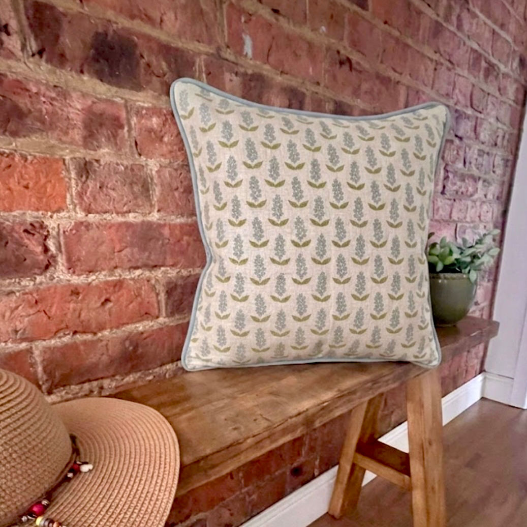 Pale blue green floral feather cushion